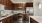a kitchen with wooden cabinets