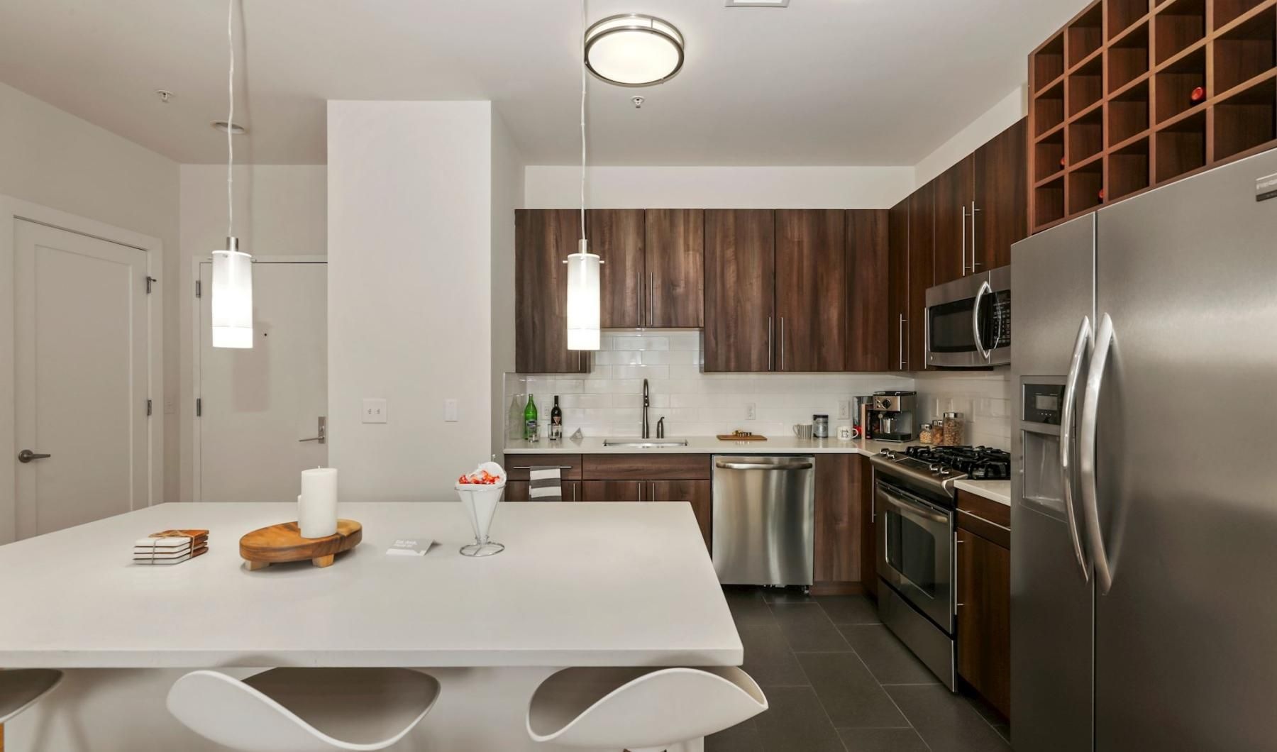 a kitchen with a table and chairs