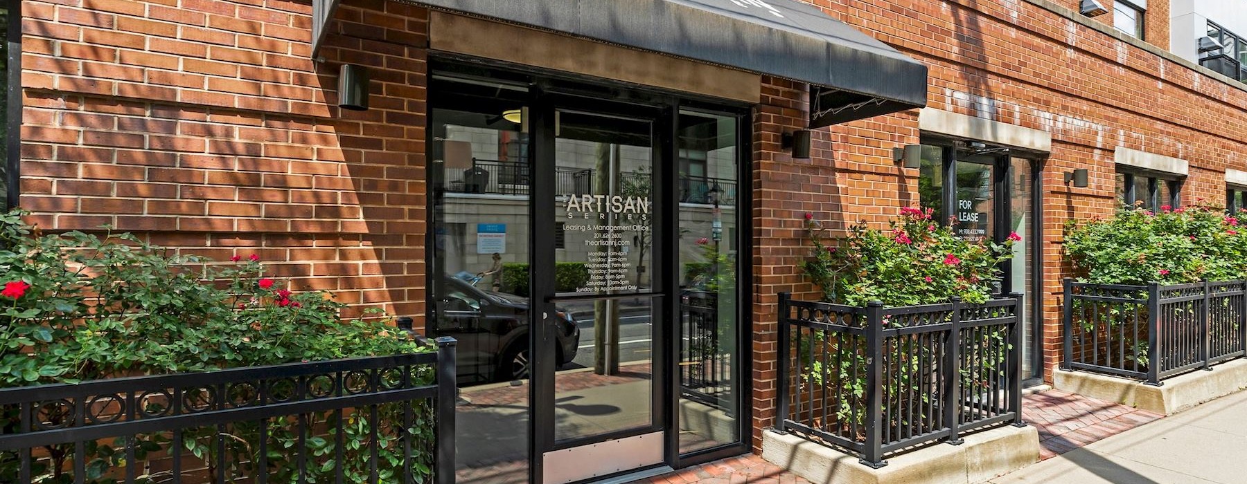 a brick building with a glass front door