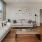 a living room with a large window and couches