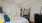 a bedroom with a bed and a tv