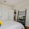 a bedroom with a bed and a tv