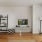 a living room with a tv and couches