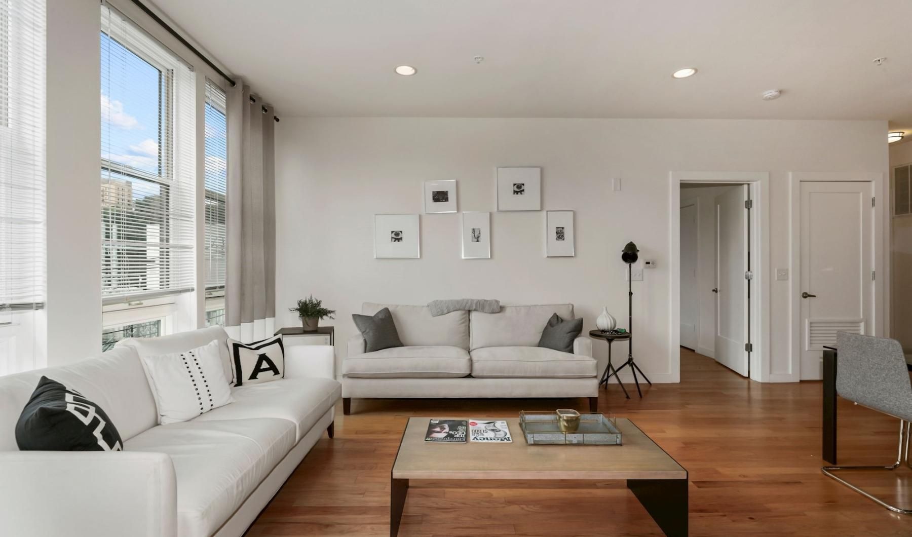Gorgeous living areas to entertain and enjoy a living room with a large window and couches