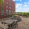 a courtyard with tables and chairs