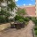 a courtyard with tables and chairs