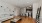 a living room with a wood floor and a couch