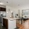 a kitchen with a large island and a living room