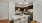 a kitchen with a table and chairs