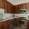 a kitchen with wooden cabinets
