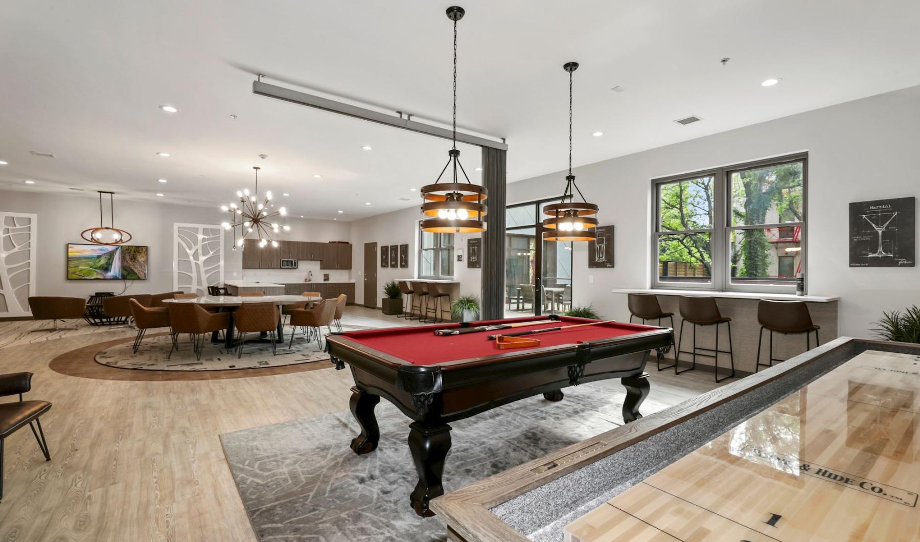 Access to resident-only features a clubroom with a pool table and chairs