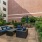 a courtyard with couches and plants