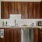 a kitchen with wooden cabinets
