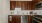 a kitchen with wooden cabinets