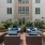 a group of blue chairs outside a building