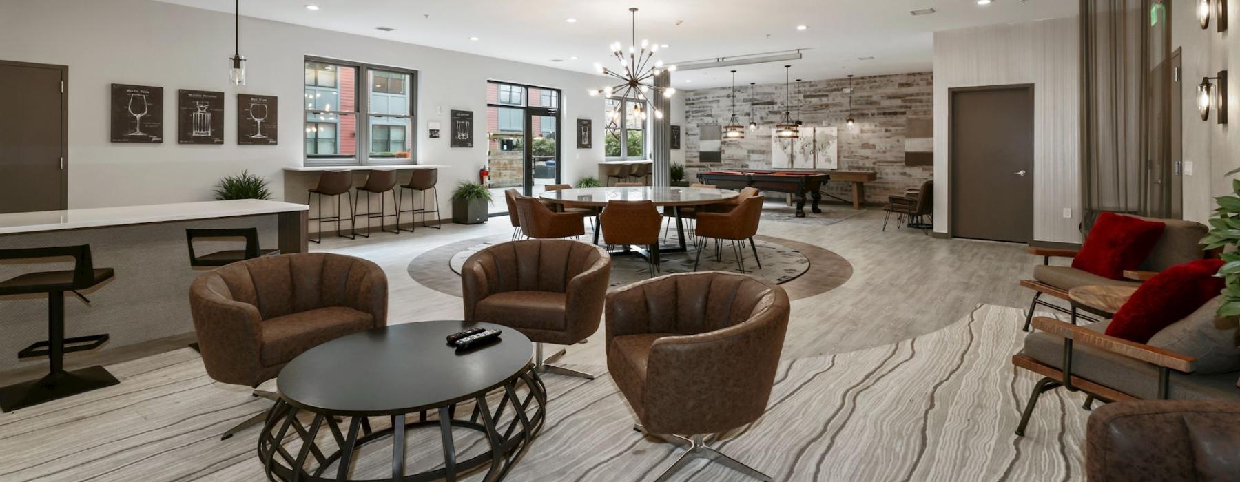 a large living room with a chandelier and a large dining table