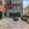 a courtyard with tables and chairs