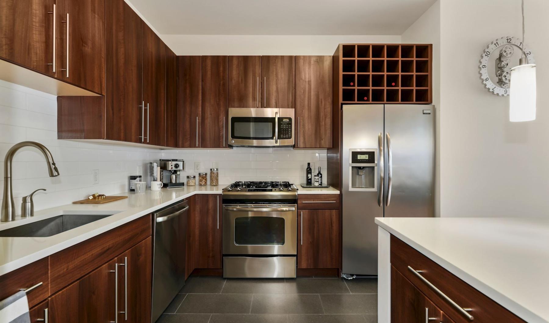 a kitchen with wooden cabinets