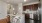 a kitchen with a table and stools