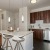 a kitchen with a table and stools