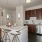 a kitchen with a table and stools