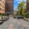 a courtyard with benches and plants