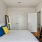 a bedroom with a tv and a bed